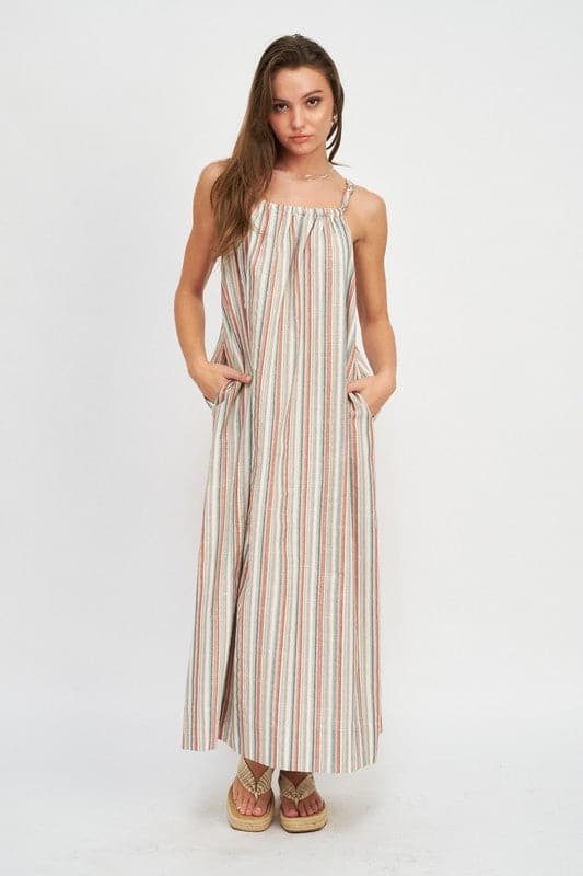 Avah Couture - Fashion doesn’t have to be complicated. This versatile and stylish dress will be the perfect companion for your spring and summer adventures. Designed for comfort, this striped maxi dress has pockets at the side and a simple knot feature on the shoulder straps. Pair it with sandals or wedges, and you’re ready to go!  Striped Sleeveless Knot shoulder strap Side pockets Maxi length 50% Cotton, 50% Polyester Hand wash cold. Line dry